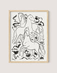 A minimalistic black and white ink drawing in a natural oak frame depicts three horses in various dynamic poses, set against a simple background with abstract shapes. The Three Horses print is signed by Leo Gestel at the bottom left corner.