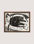A framed Lying Cat print showcases a cat lounging on a curved surface, rendered in bold, dark strokes that contrast against the lighter background. Embracing an artistic vision reminiscent of Kirchner, the walnut oak frame adds an elegant touch.
