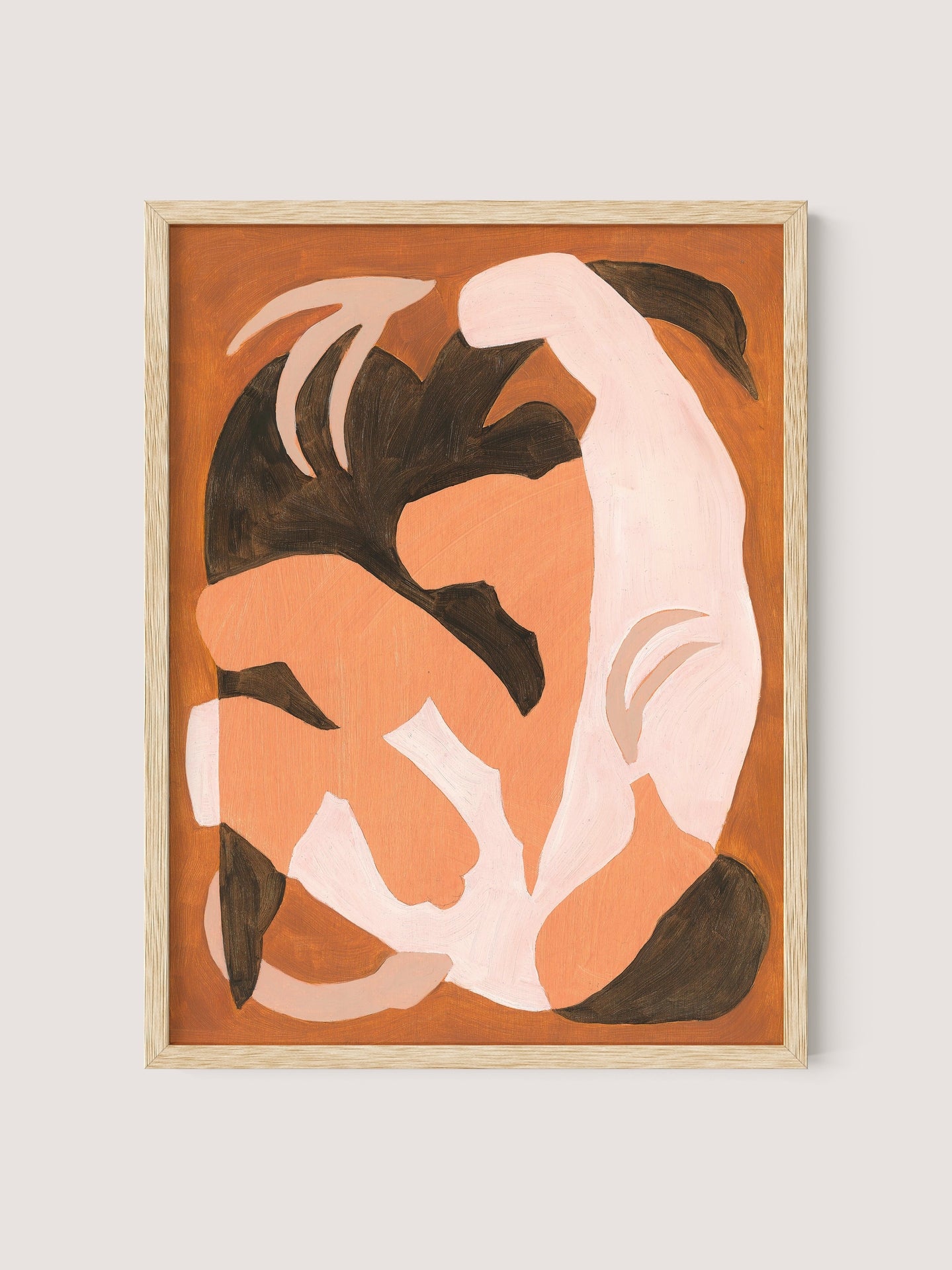 The "Swan Study I" features fluid, intertwined shapes in shades of brown, peach, and black against a brown background. Framed in natural oak, the organic forms appear to be in a dynamic, flowing motion akin to a poetic dance, creating a sense of movement and harmony.