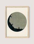 Introducing "Moon" – a framed artwork featuring an abstract circular design reminiscent of Japanese aesthetics. The circle has a textured, cloudy grey section on the top right, blending into a dark green and black background with subtle floral patterns. The natural oak frame contrasts beautifully with the simple, light beige background.