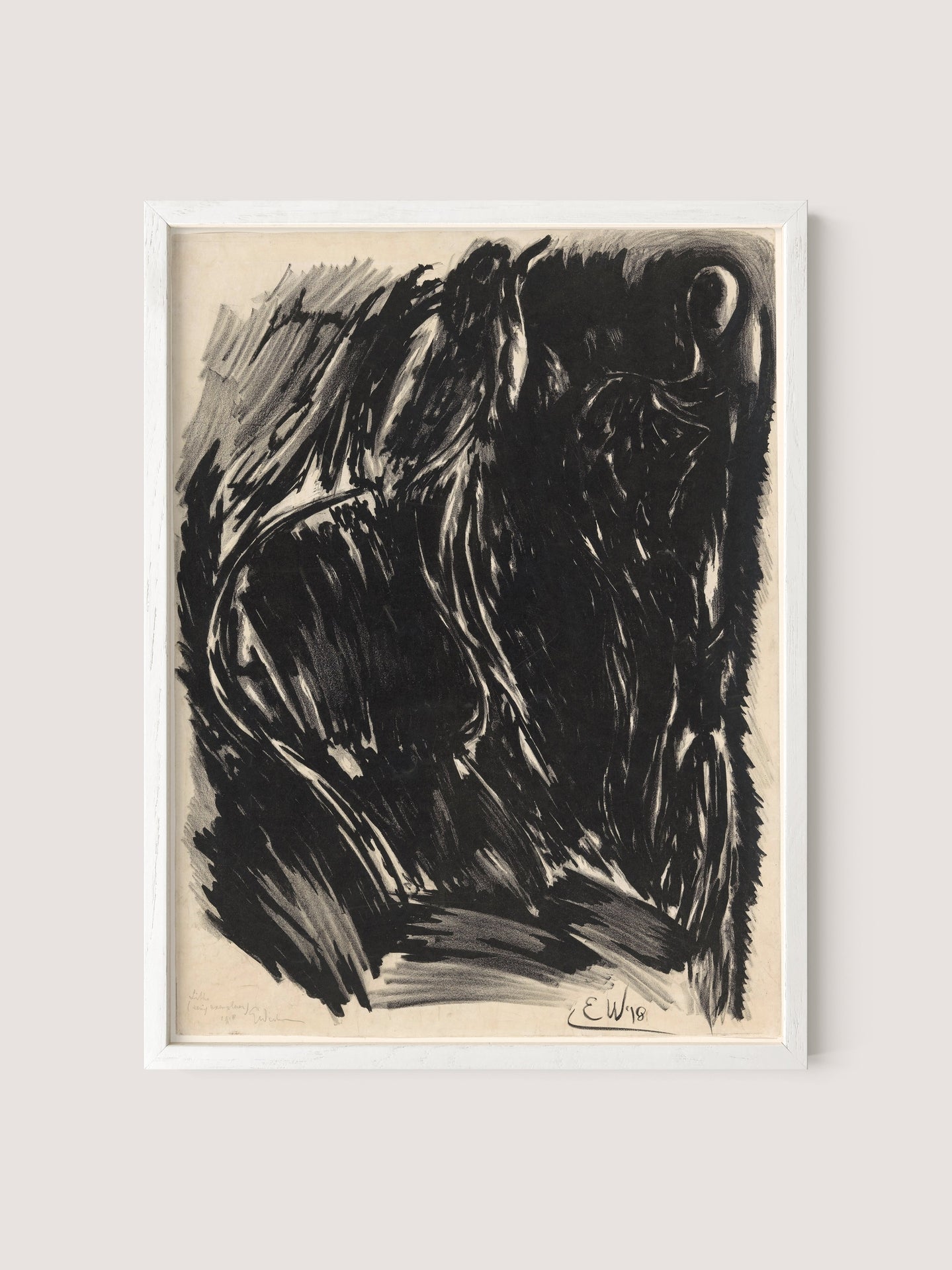 The "Stormy Abstraction" charcoal drawing, set in a White Oak frame, features abstract dark forms and sweeping lines that create an intense and dynamic composition with elemental drama. The black and white palette subtly hints at a humanoid or animal shape against the light background. The artist's signature, "E.W.," is visible in the bottom right corner.
