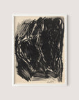 The "Stormy Abstraction" charcoal drawing, set in a White Oak frame, features abstract dark forms and sweeping lines that create an intense and dynamic composition with elemental drama. The black and white palette subtly hints at a humanoid or animal shape against the light background. The artist's signature, "E.W.," is visible in the bottom right corner.
