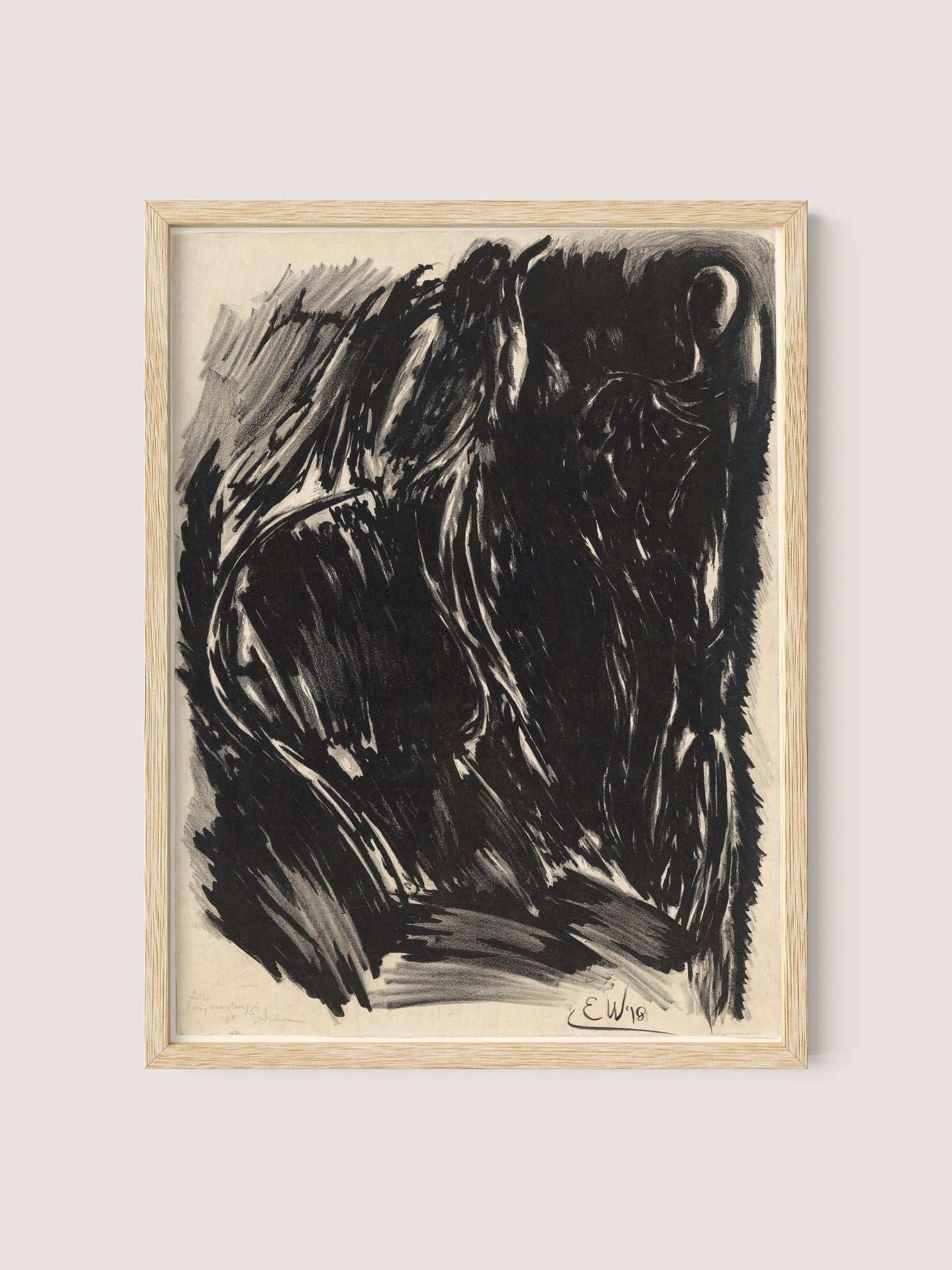 The "Stormy Abstraction" features a framed charcoal drawing on a white background, characterized by abstract and dark, intense strokes. The composition evokes elemental drama and emotion with bold, swirling lines. A signature "E.W." and the year "1915" are visible at the bottom of the artwork. The drawing is elegantly housed in a natural oak frame.