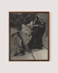 The Serenaders" is a framed black-and-white print featuring two feline friends seated side by side. The cat on the left has a striped pattern, while the cat on the right, which is dark-colored, appears to be affectionately licking the other cat's ear. They are perched on a tiled surface, all framed in elegant Walnut Oak.