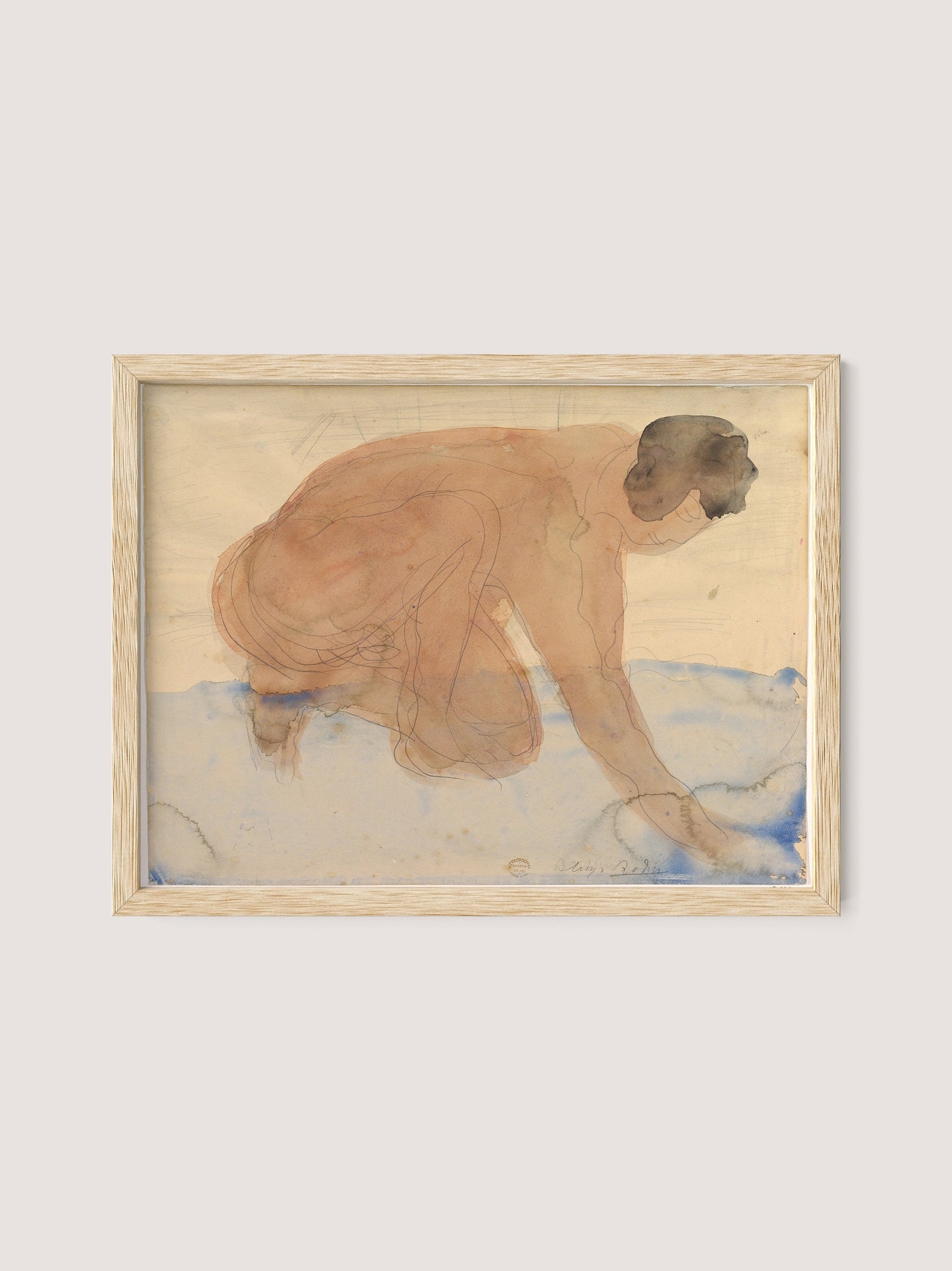 The framed watercolor painting titled "Nude Figure on Hands and Knees" features a crouching person with short hair. The nude figure, lightly sketched in earthy tones, appears to be reaching forward. Set against a light background, the ground is suggested with light blue and vague shapes, creating a marine-inspired backdrop. The piece is framed in natural oak.