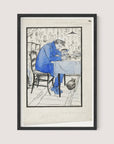 The framed drawing titled 'The Writer' in a pencil line style depicts a lone figure dressed in blue, sitting at a table with one hand resting on their head, appearing contemplative. The indoor scene features patterned wallpaper and an empty chair next to the figure. A charming cat sits on the floor to the right of the table. The frame is finished in an elegant Black Oak.