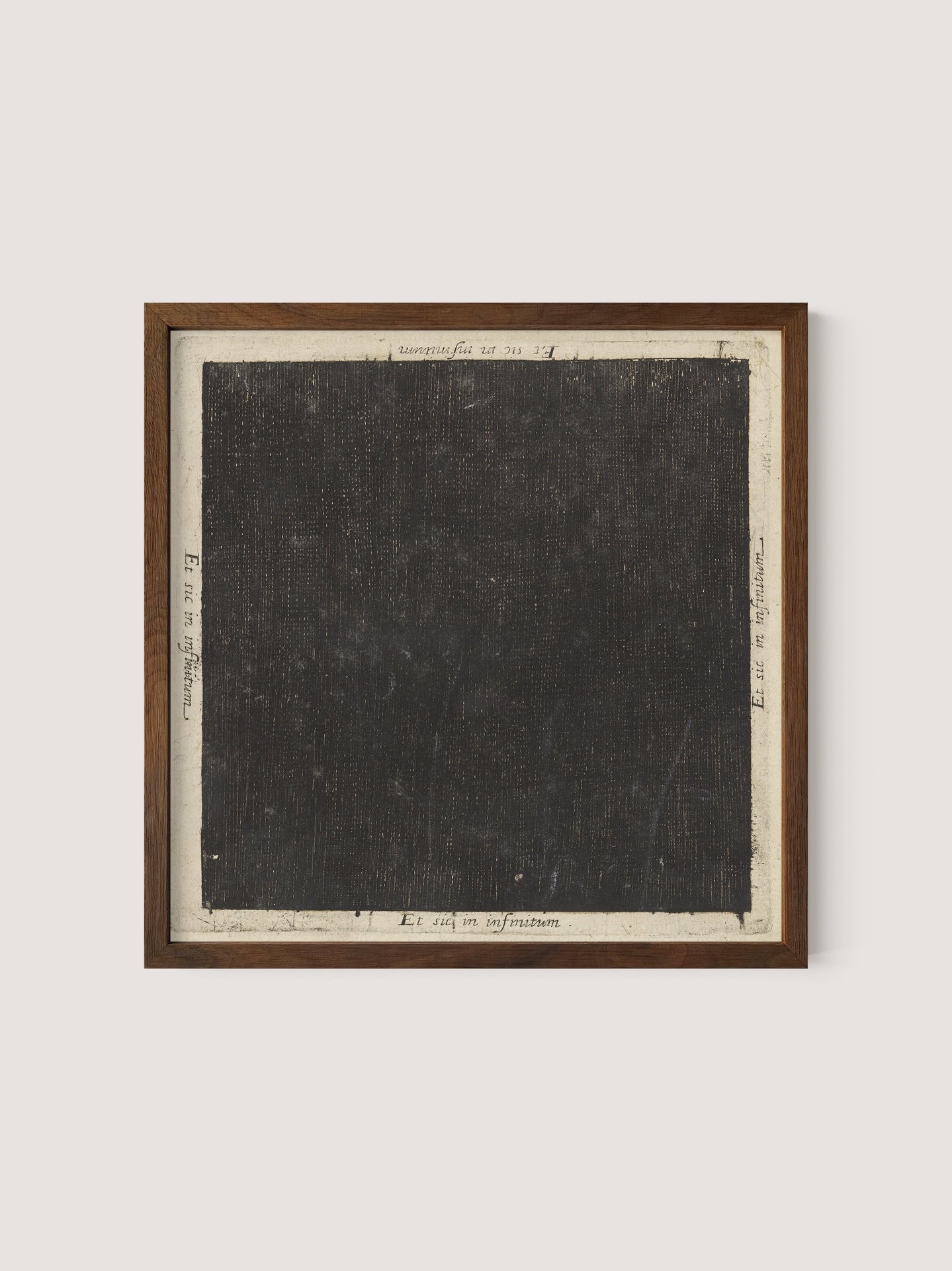 Introducing the Cosmic Square: a framed piece of art reminiscent of Flood&#39;s seminal work. It features a large, textured black square with a light grey border. Various small handwritten notes and mathematical notations are artistically scattered around the edges of the square on the border. The frame is elegantly crafted from Walnut Oak wood.