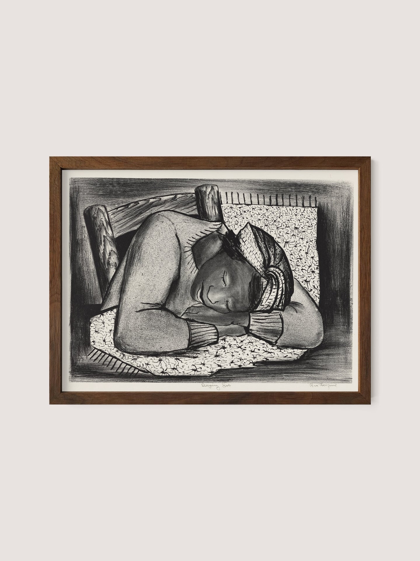 Sleeping Girl,&quot; framed artwork by Riva Helfond, depicts a person with a headscarf sleeping on a bed. The figure rests their head on a pillow, with arms folded under their head. This black-and-white piece, featuring a walnut oak frame and evoking the artistic revival of the Works Progress Administration, exudes a calm, peaceful ambiance.