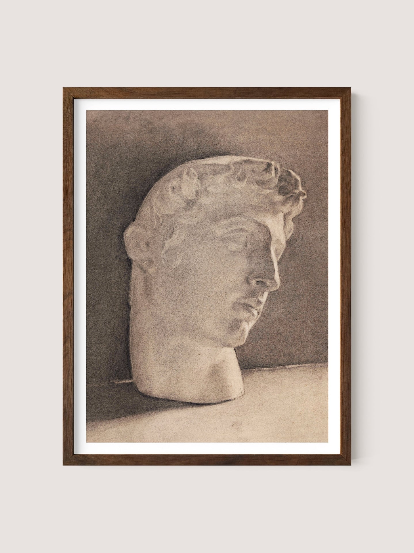 The framed monochromatic sketch, titled &quot;Study of a Plaster Head,&quot; features a neoclassical-style marble bust of a male head with curly hair. The head is turned slightly to the right, and the background is shaded in darker tones, enhancing the minimalist elegance of the Walnut Oak piece.