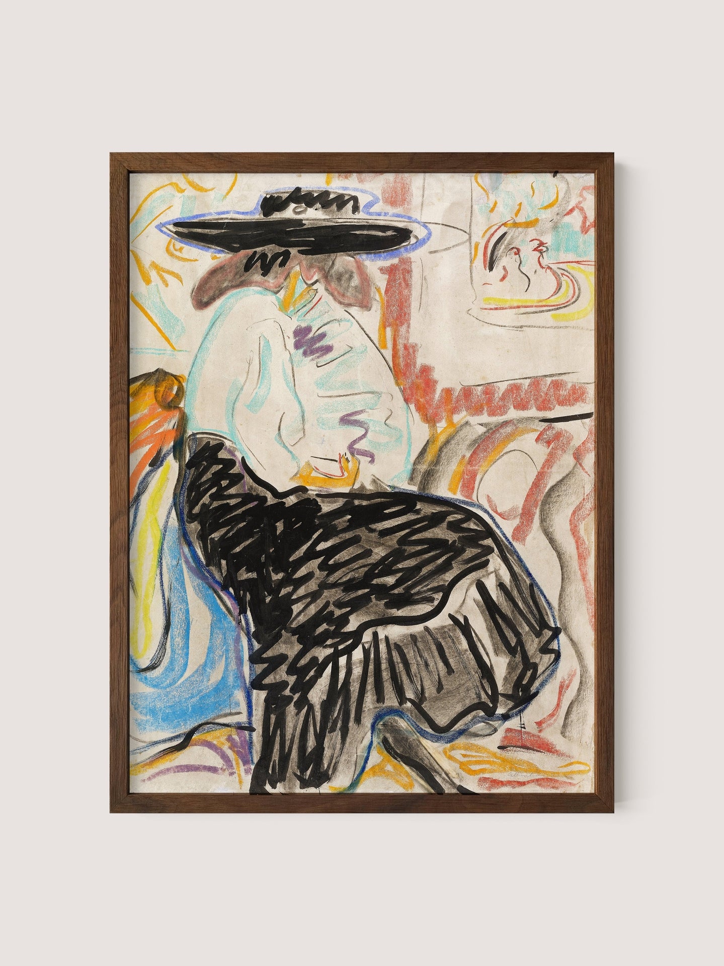 A framed portrait titled &quot;Seated Woman in the Studio,&quot; available in a Walnut Oak finish, depicts a person sitting on a chair, wearing a wide-brimmed hat, a light-colored blouse, and a darker, flowing skirt. This piece of figurative art features bold, expressive brushstrokes and a colorful, abstract background reminiscent of Kirchner&#39;s style.