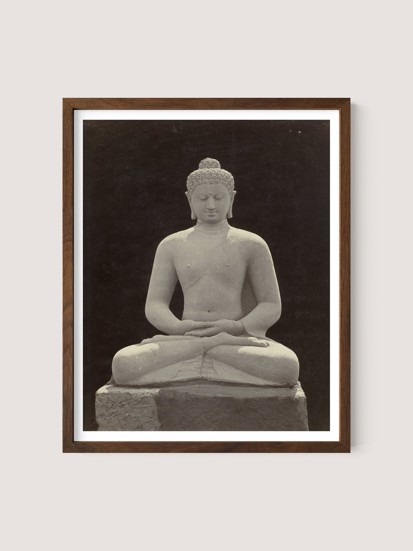 A walnut oak-framed photograph of the Buddha Statue, capturing an image of a seated Buddha with legs crossed and hands in a meditative position. The Buddha’s eyes are closed, evoking the serenity of a Buddhist sanctuary, with no visible background detail.