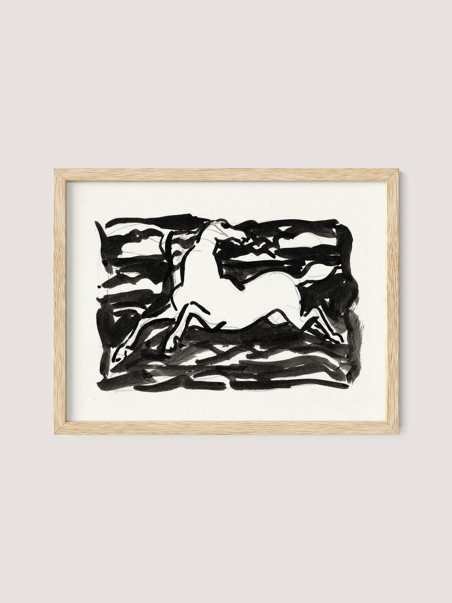 A framed monochromatic ink artwork, named "Leaping Horse," showcases a stylized horse in mid-movement. The horse is illustrated in white with bold, abstract black strokes creating a dynamic background. The natural oak frame highlights the simple yet striking composition, evoking the style of Leo Gestel.