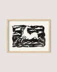 A framed monochromatic ink artwork, named "Leaping Horse," showcases a stylized horse in mid-movement. The horse is illustrated in white with bold, abstract black strokes creating a dynamic background. The natural oak frame highlights the simple yet striking composition, evoking the style of Leo Gestel.