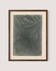 This abstract art piece, titled *Abstract Composition I*, framed in walnut oak, exudes a tranquil wonder with its variations of dark green hues. The texture appears smoky and fluid with indistinct shapes, while handwritten notes and a signature are visible at the bottom of the museum-quality canvas.