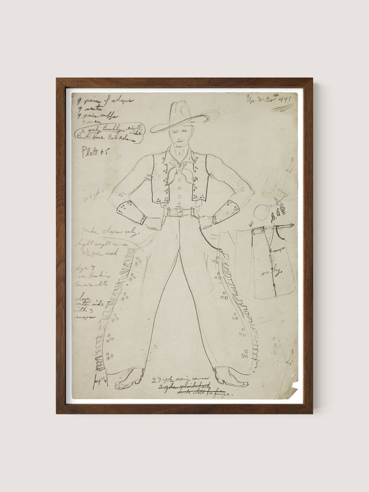 A framed sketch of the Cowboy Costume in a walnut oak shade, showcasing a person adorned in a cowboy outfit complete with a hat, vest, shirt, and pants highlighted with button embellishments. This detailed costume design is surrounded by handwritten annotations and measurements around the figure, reflecting the meticulous craftsmanship typical of the Federal Theatre Project.