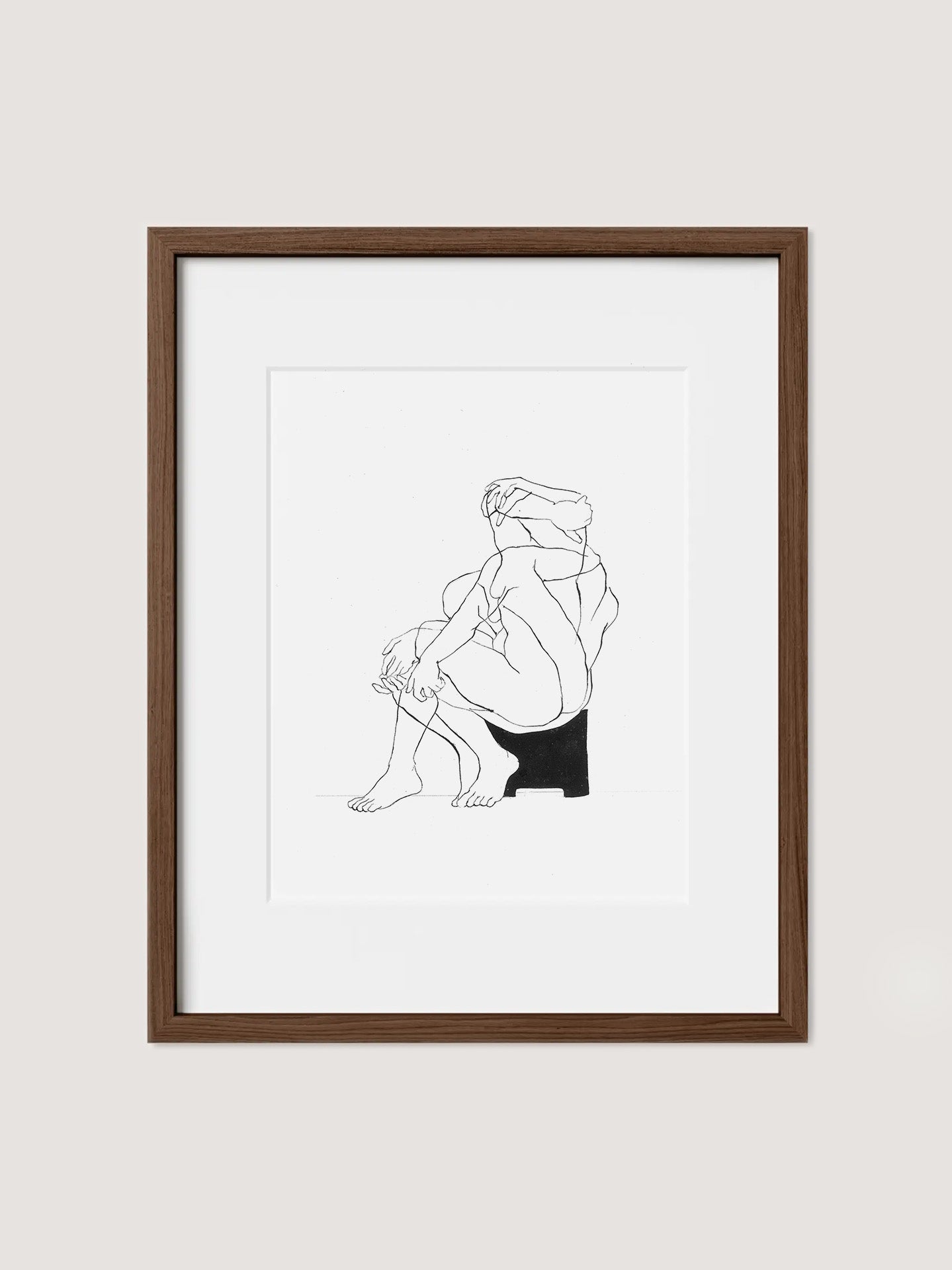 Introducing the Samantha Michell II, a limited edition minimalist line drawing featuring a nude figure sitting on a stool. With its sleek black lines set against a pristine white background, this artwork emphasizes the figure's contours and posture. Framed in elegant Walnut Premium Oak, this original piece embodies modern and abstract style.