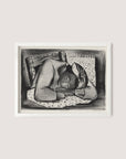 A framed artwork titled "Sleeping Girl," created by Riva Helfond, depicts a person resting their head on folded arms atop a blanket or patterned cloth. The individual, with closed eyes and a headscarf, appears peaceful and serene. The white oak frame complements the simple, textured background patterns reminiscent of the Works Progress Administration's artistic revival.