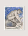 Charcoal and pastel artwork titled "The Bath," depicting a nude figure kneeling with head bent forward and hands reaching towards the ground, set against a blue and white background. The impressionist style imbues it with refined elegance, further enhanced by a simple white oak frame.