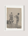 Beach Walk, a framed photograph with a sepia tone that echoes the artistic style of Thomas Eakins' work, features two nude individuals standing on a rocky beach, their backs facing the camera. A boat is partially visible on the left side of the picture, enhancing its old, vintage allure. The frame comes in a refined White Oak color.