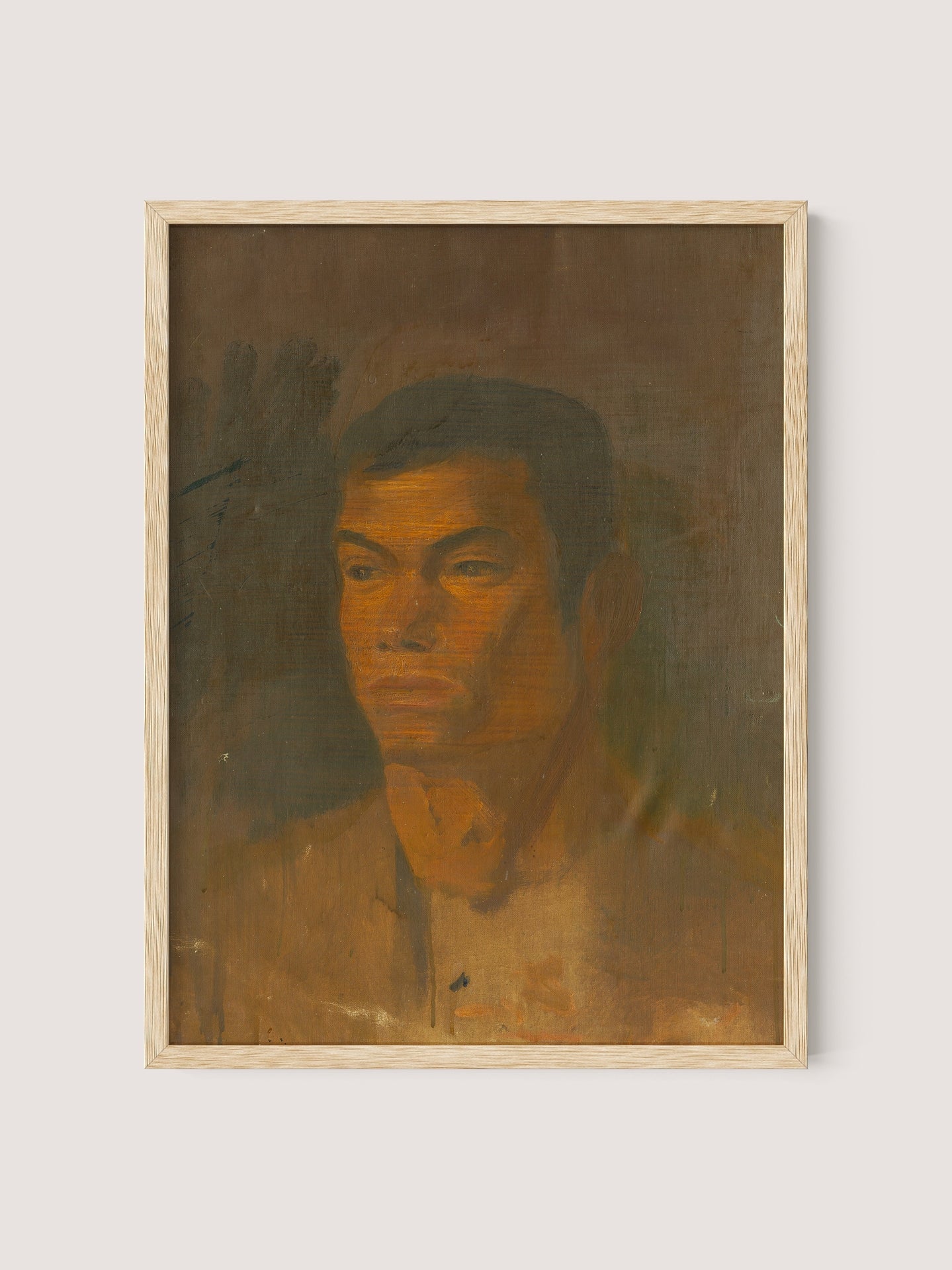 The framed painting titled "Head of a Gypsy Boy" by Ladislav Mednyánszky features a man's face and upper torso. The artwork employs a warm, earthy color palette with shades of brown, orange, and yellow. The man wears a neutral expression while the background is blurred and dark, creating a subdued atmosphere—making it truly sophisticated timeless décor. Encased in a Natural Oak frame, this piece adds an exquisite touch to any space.