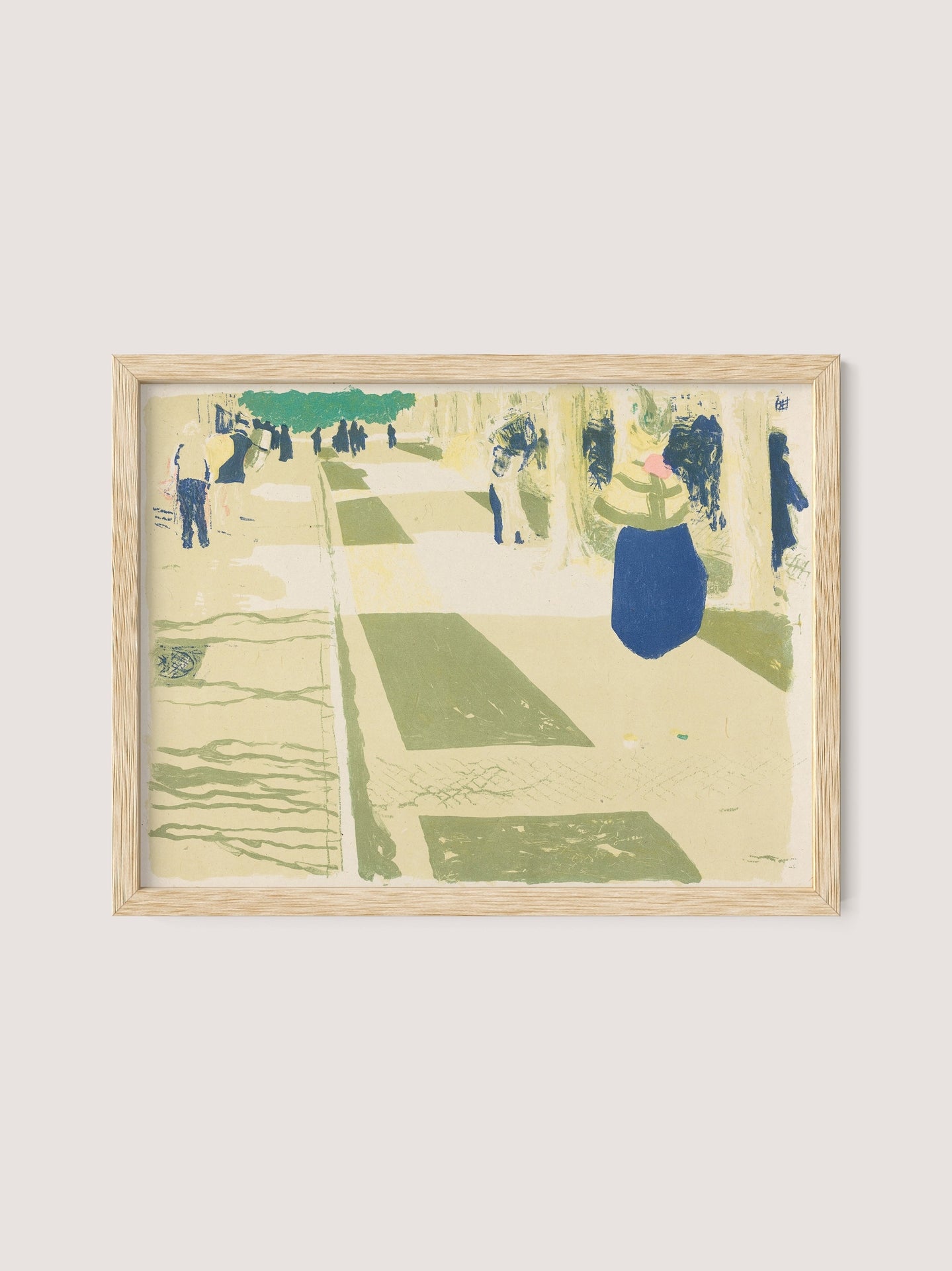 The framed artwork, "L'avenue," shares the nuanced style of Vuillard, illustrating an abstract street scene populated with indistinct figures and structures in various shades of green and blue. The light beige background adds to the dreamlike, impressionistic quality of the piece, further accentuated by its natural oak frame for a captivating color palette.