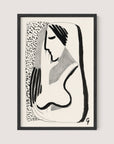 Introducing "Thoughtful Woman," a framed black and white minimalist ink drawing of a woman with long hair. The minimalist lines elegantly depict the figure's side profile, emphasizing her face and upper body. The background features a speckled pattern, making it versatile for various interior styles. Set in a sleek Black Oak frame, the artwork is signed by the artist in the bottom right corner.