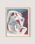 The "Lovers" artwork, framed in natural oak, features intertwining human forms in shades of red, blue, and gray. Reminiscent of a modern yin-yang art style, the dynamic figures are depicted with minimalist features and fluid lines. Ideal for gallery wall decor, this piece adds depth with its transitioning background.