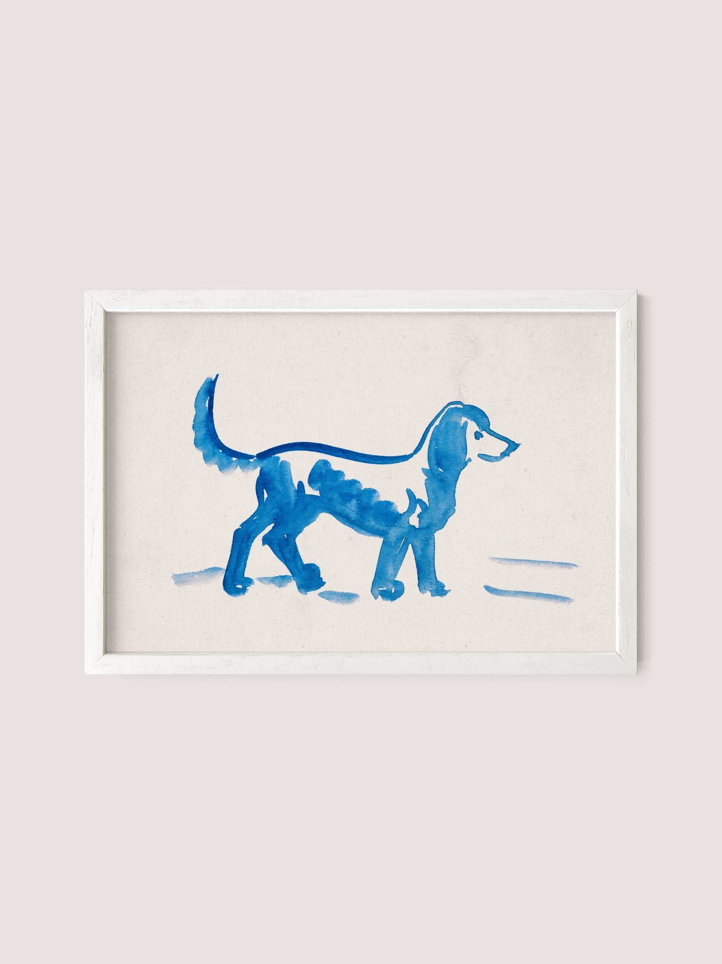 A framed watercolor painting titled "Great Dane" by Peter Weisz Kubínčan depicts a blue dog walking to the right. The artwork showcases simple, fluid brushstrokes on a light beige background, incorporating shades of blue that add a touch of elegance to any space with its white oak hues.