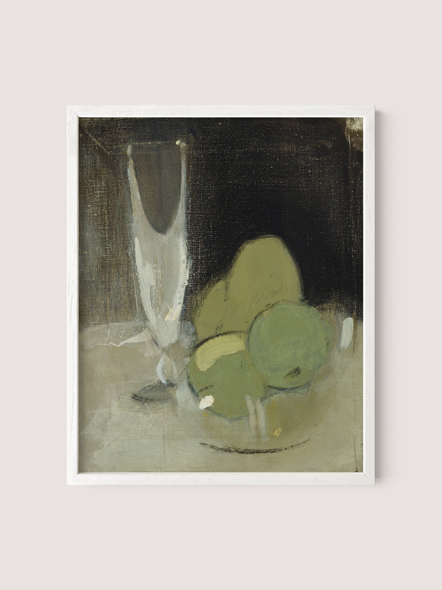 The "Green Apples And Champagne Glass" features a framed painting that depicts a still life with three greenish fruits in a glass bowl resting on a light-colored surface. A tall, transparent glass is positioned in the background against a dark backdrop, creating contrast with the muted earth tones of the objects and exuding timeless elegance. The frame itself is made from white oak, adding to its sophisticated appeal.